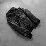
Perspective portée de Bouncer Biz Black Leather Hooded Bomber Jacket sur modèle - Tombé naturel à la lumière du jour