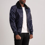 
Blue Satin Bomber Jacket - Vue arrière montrant la carrure ajustée et l'ourlet net
