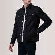 
Colberto Noir Waxed Canvas Trucker Veste en Cuir pour Homme For Men - Vue de profil mettant en valeur la coupe de manche ergonomique