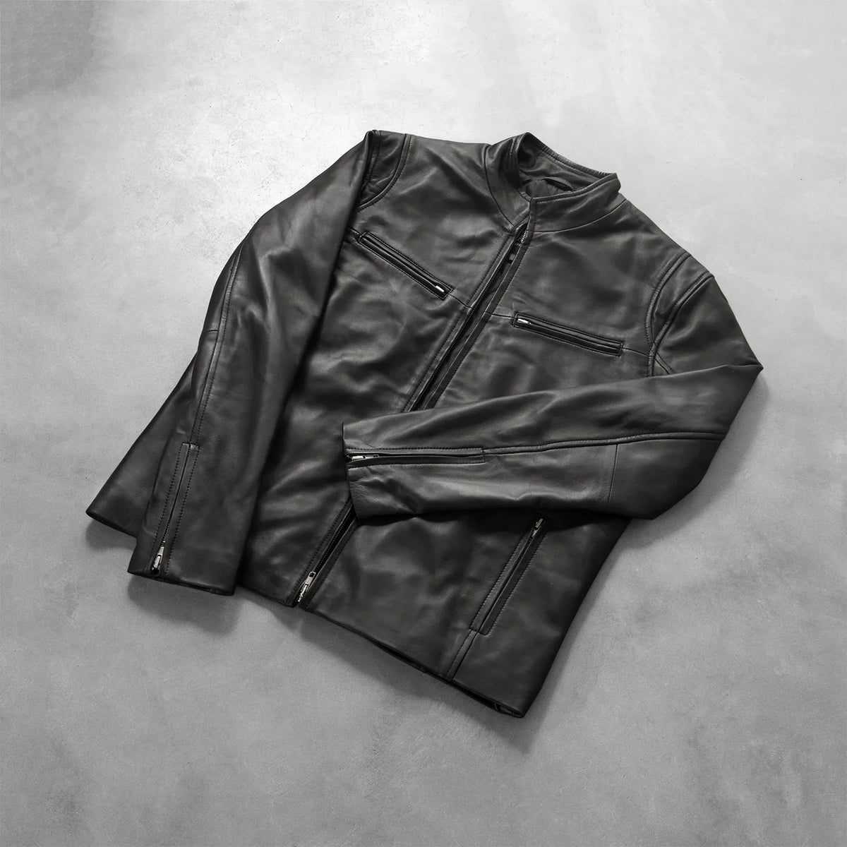 Zipper &amp; Hem Craftsmanship Construction Detail on Men's Ionic Black Leather Jacket