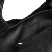 
Tenara Sac à main en cuir pleine fleur - Vue de profil mettant en valeur la coupe de manche ergonomique