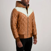 
Perspective portée de Norman Tan Hooded Bomber Leather Puffer Jacket sur modèle - Tombé naturel à la lumière du jour