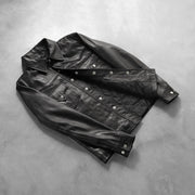 
Button & Hem Craftsmanship Construction Detail on Ranchson Noir Leather Shirt pour Homme